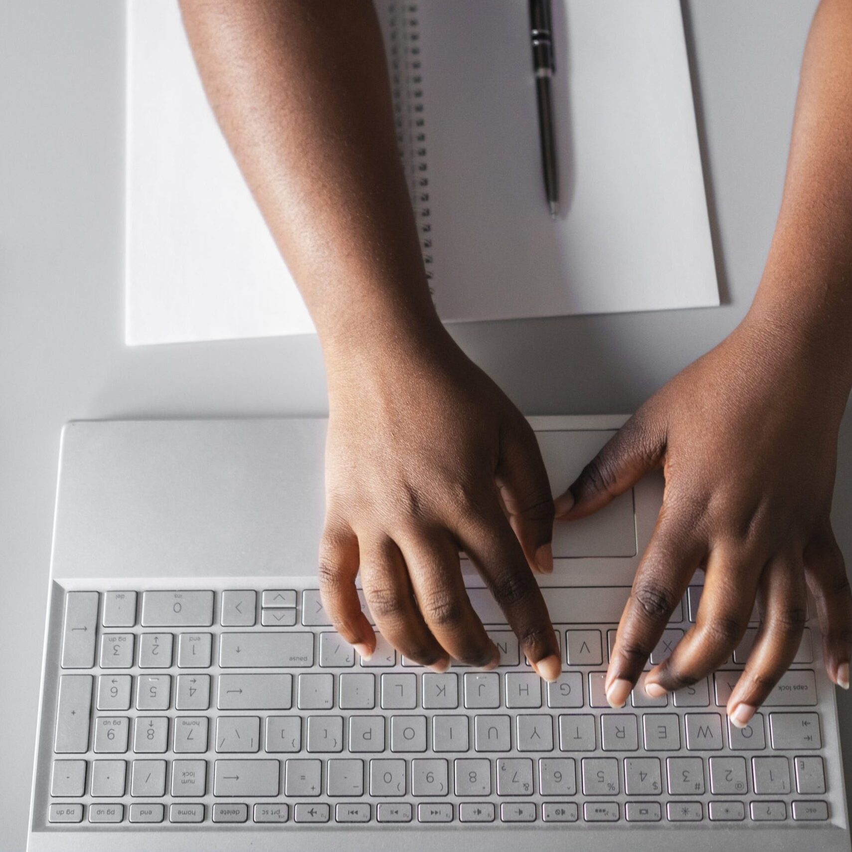 hands-typing-keyboard-top-view
